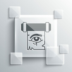 Grey Eye of Horus on papyrus scroll icon isolated on grey background. Parchment paper. Ancient Egypt symbol. Square glass panels. Vector
