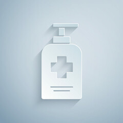 Paper cut Bottle of liquid antibacterial soap with dispenser icon isolated on grey background. Antiseptic. Disinfection, hygiene, skin care. Paper art style. Vector.