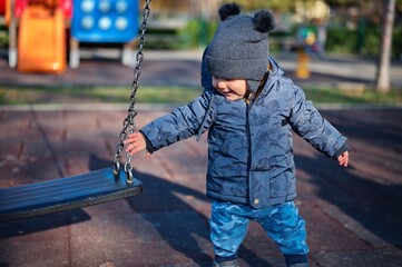 Portrait of sweet little boy on playground