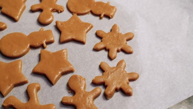 Making homemade gingerbread cookies step by step. DIY concept. Put the gingerbread on a baking sheet and bake. Step 16