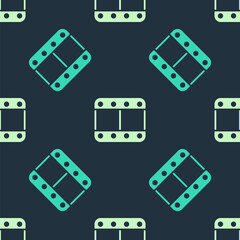Green and beige Play video icon isolated seamless pattern on blue background. Film strip sign. Vector