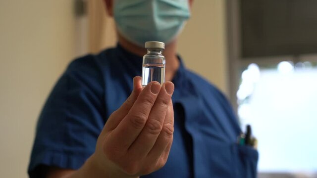 Europe, Italy, Milan December 2021 - Vaccination against covid-19 Coronavirus epidemic with generic vaccine dose no logo , Omicron variant - third dose of vaccine