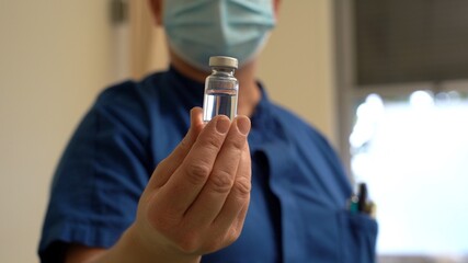 Europe, Italy, Milan December 2021 - Vaccination against covid-19 Coronavirus epidemic with generic vaccine dose no logo , Omicron variant - third dose of vaccine