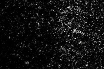 white icy snowflakes isolated on black background, natural background