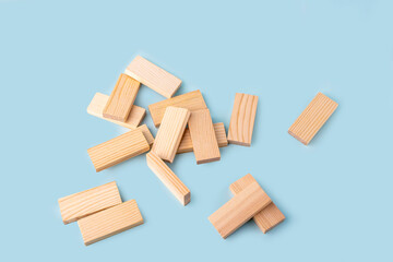 Board game Tower of wooden blocks scattered, fallen. Business concept. Activity for strategy, concentration, agility, logic and coordination. Teamwork balancing. Copy space.
