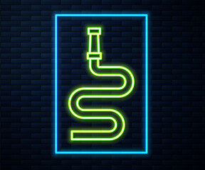 Glowing neon line Fire hose reel icon isolated on brick wall background. Vector