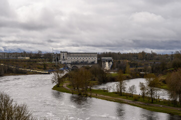 Obraz premium View from the fortress wall to Narva Hydroelectric Power Plant. Ivangorod fortress. Old fortress walls. Historical sites.