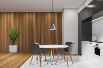 Black and white kitchen interior with table and chairs, wooden floor