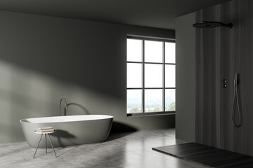 Fototapeta na wymiar Dark bathroom interior with bathtub, shower and window, concrete floor. Mockup