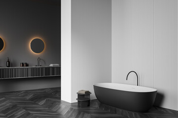 Fototapeta na wymiar Dark bathroom interior with bathtub, sink and mirror, parquet floor