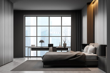 Fototapeta na wymiar Dark bedroom interior with bed on concrete floor, window and workplace
