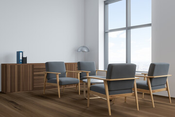 Naklejka na ściany i meble Bright office room interior with panoramic window, four comfortable armchairs