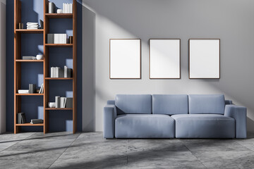 Bright living room interior with three empty white posters