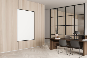 Corner view on bright office room interior with empty poster