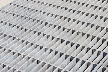 steel grating background and texture. tiled metal ground grid.