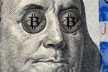 Benjamin Franklin portrait with Bitcoin Eyes from one hundred american dollars conceptual image for worldwide cryptocurrency and digital payment system.