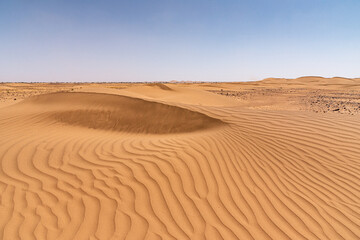 In the Sahara Desert in Morocco. The dunes of Erg Chegaga, with the furrows carved by the wind in the sand