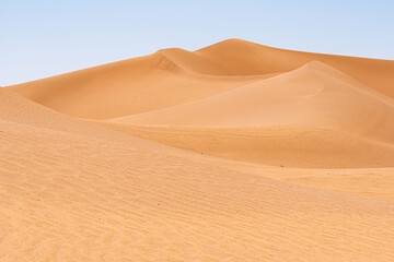 Fototapeta na wymiar In the Sahara Desert in Morocco. Erg Chegaga sand dunes