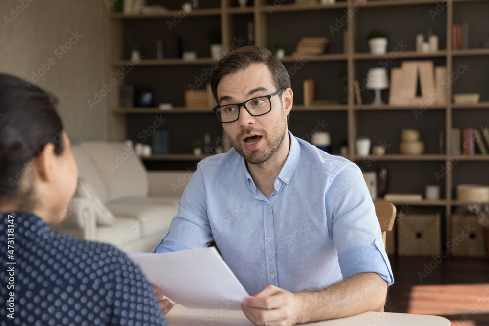 Wall mural excited employer asking job candidate about resume, work experience on interview in office. business