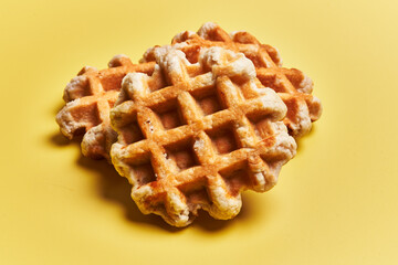  Bunch of delicious waffles over yellow background