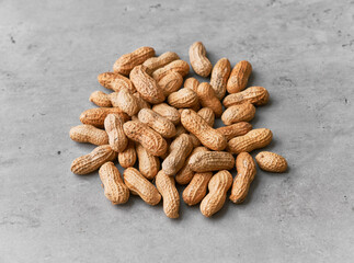 Image of bunch of peanuts on a concrete surface