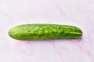  Single cucumber on a marble surface