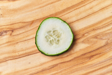  Slice of cucumber on a wooden table