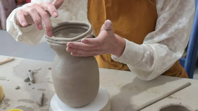 woman hands are manufacturing an beautiful ceramic mug