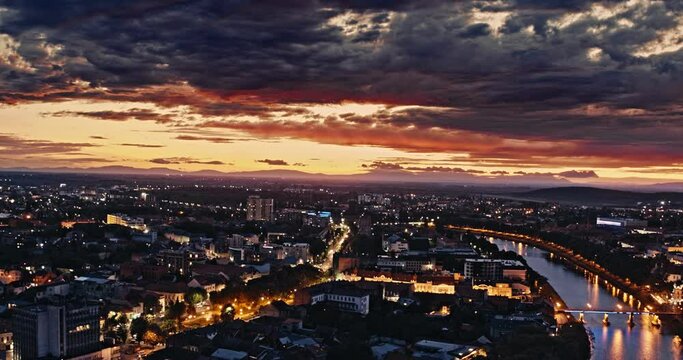 Aerial shot: Incredible sunset over the city Uzhhorod and river Uzh. 4k