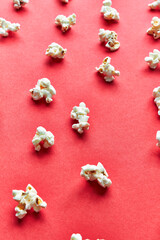  Bunch of salty popcorns on a red background
