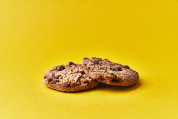  Delicious chocolate cookies on a yellow background
