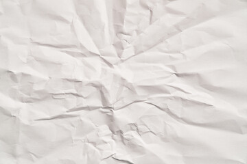 White crumpled paper texture with wrinkles. Damaged and torn sheet