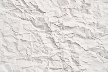 White crumpled paper texture with wrinkles. Damaged and torn sheet