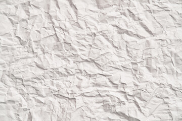 White crumpled paper texture with wrinkles. Damaged and torn sheet
