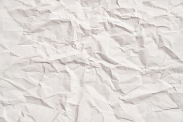 White crumpled paper texture with wrinkles. Damaged and torn sheet