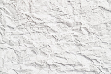 White crumpled paper texture with wrinkles. Damaged and torn sheet