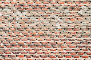 Obraz premium Brick wall texture with cracked tiles and cement. Classic brickwall surface background