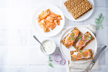 Picked salmon cream cheese rye bread in a plate