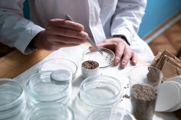 close up of a person holding a glass of water