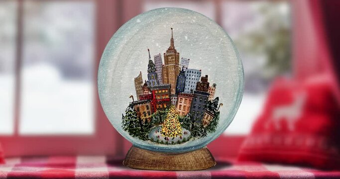 Glass snow globe, Christmas tree and city inside the glass globe. It's snowing inside a snow globe with a christmas tree. New York City Christmas snowball.