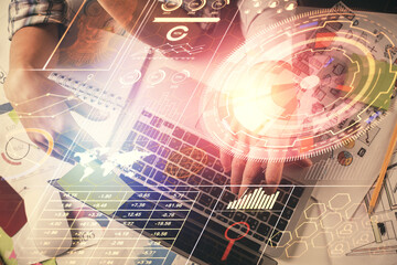 Double exposure of man and woman working together and data theme hologram drawing. Computer background. Top View.