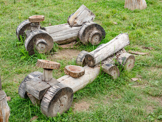 Truck built from wooden trunks. Popular toy or children attraction