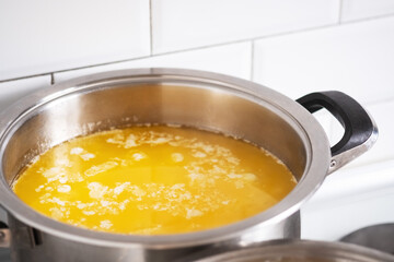 Melt the butter in a stainless saucepan. Cooking ghee.