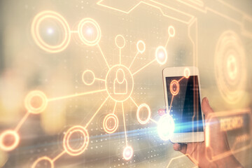 Double exposure of social network sketch hologram and woman holding and using a mobile device.