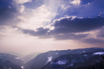 The hills of the Black Forest disappear into the haze in the light of the sunset.