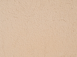 Texture of a yellow wall with sand.