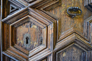 Barcelona, Spain - 23 Nov, 2021: Wooden door keyhole at the Archive of the Crown of Aragon in Barcelona, Catalonia, Spain