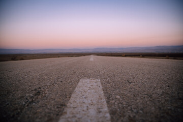road in desert sunset