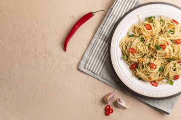 Italian pasta aglio e olio with olive oil, garlic and chili pepper. Flat lay. Copy space.
