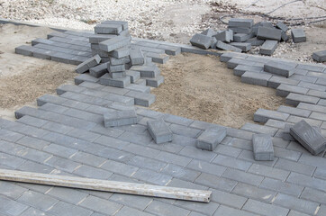 Laying paving slabs in the yard.